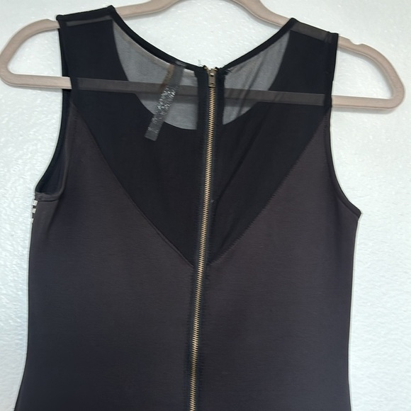 Short stretch dress with metallic stones on a black base, curvy cut, size S - Picture 5 of 10